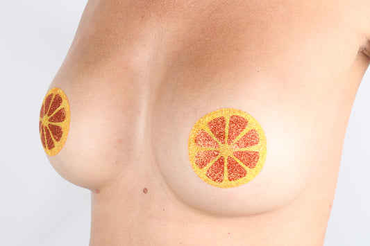 Model Image - Orange Fruit Slice Glitter Pasties applied to female model